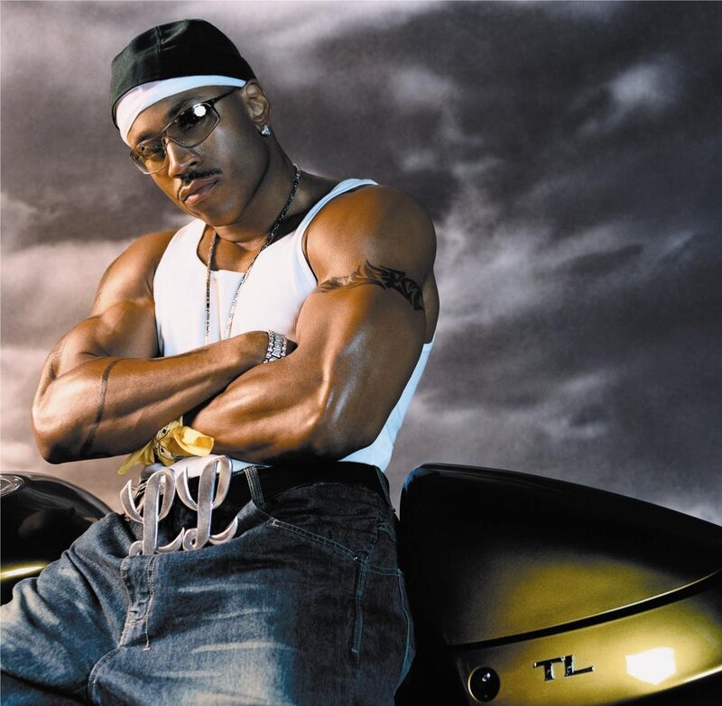 man with muscular arms on motorcycle