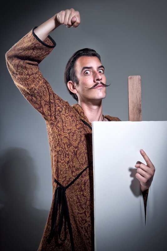 man with mustache and canvas