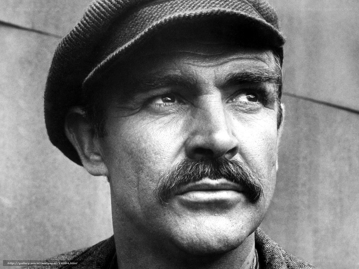 man with mustache and cap