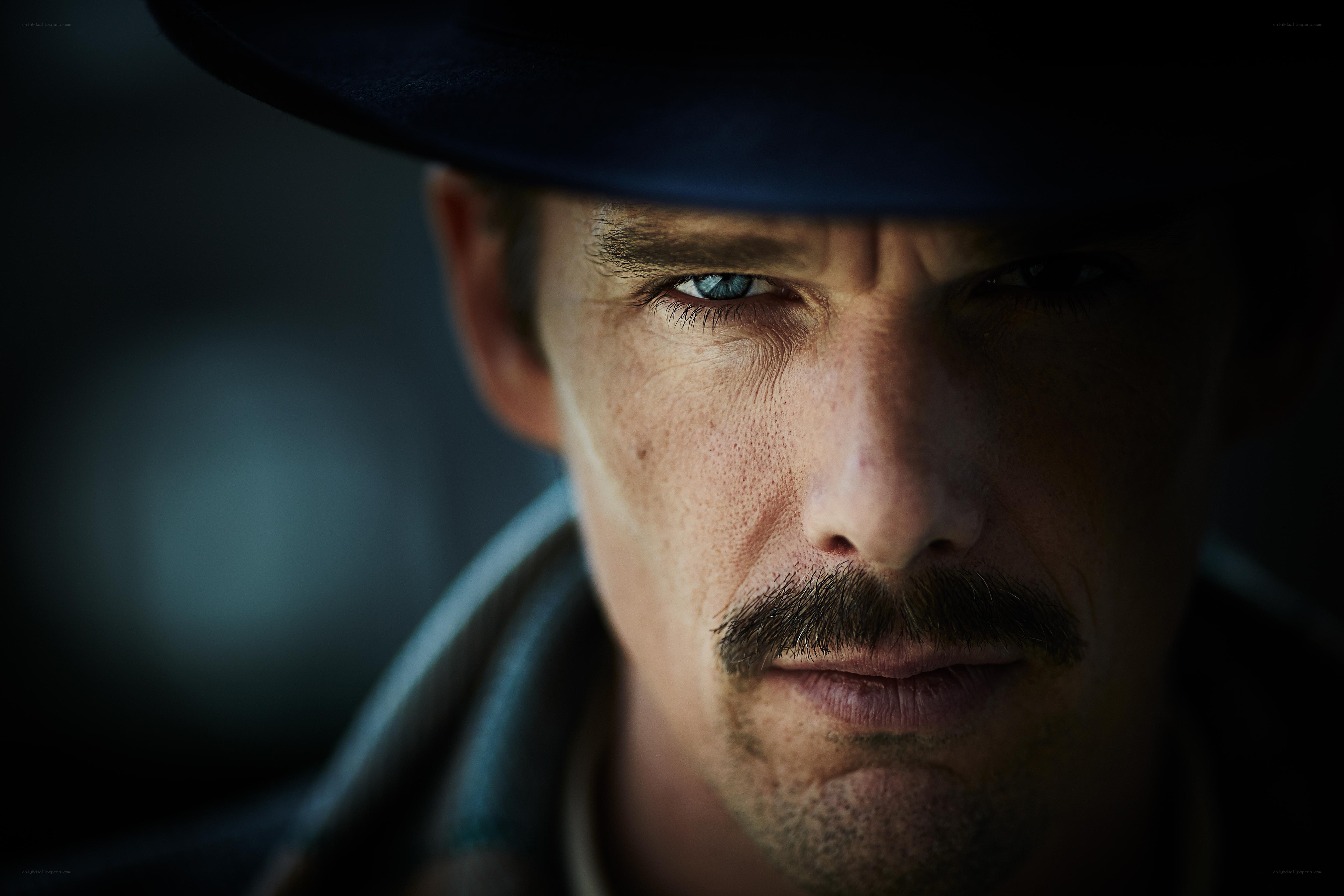 man with mustache and hat