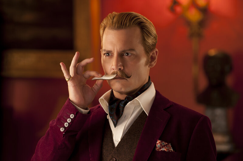 Man with Mustache Holding Comb