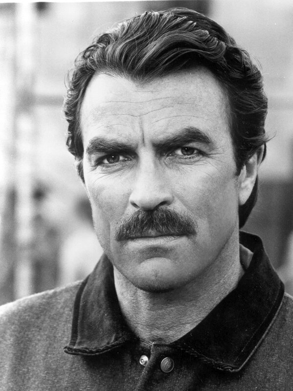 man with mustache in black and white