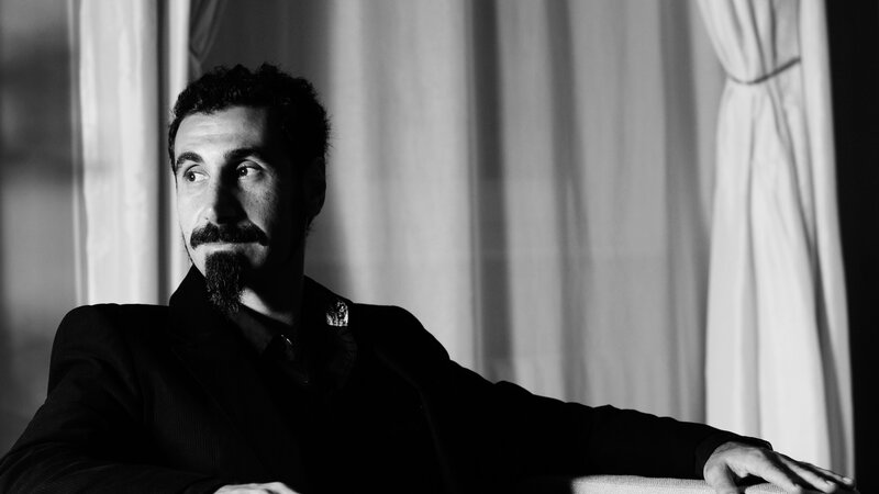 man with mustache in black and white