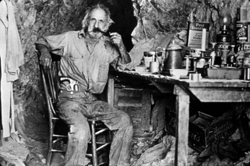 Man with Mustache in Cave