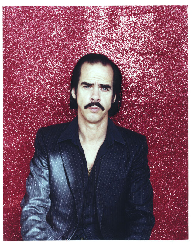 man with mustache in pinstripe suit