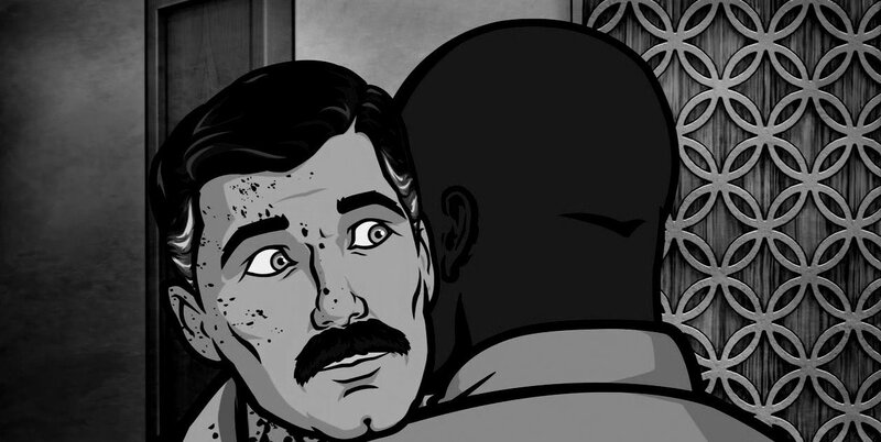 man with mustache in shadow