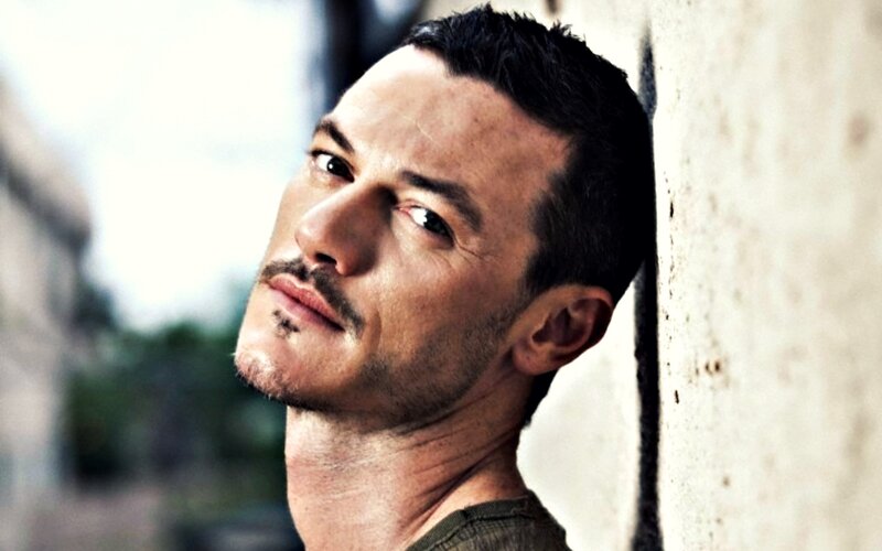 Man with Mustache Leaning