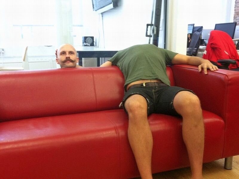 Man with Mustache on Couch