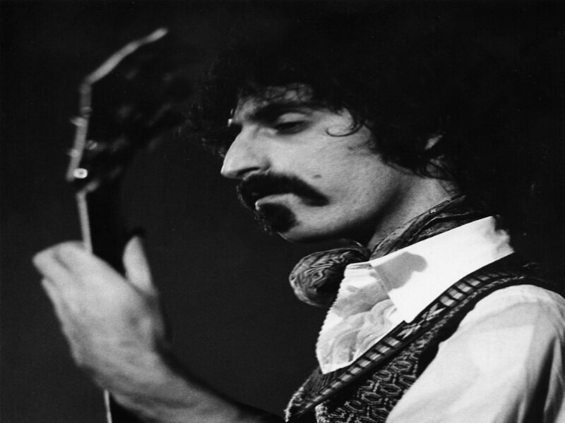 Man with Mustache Playing Guitar