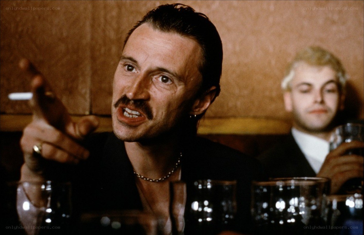 man with mustache pointing finger
