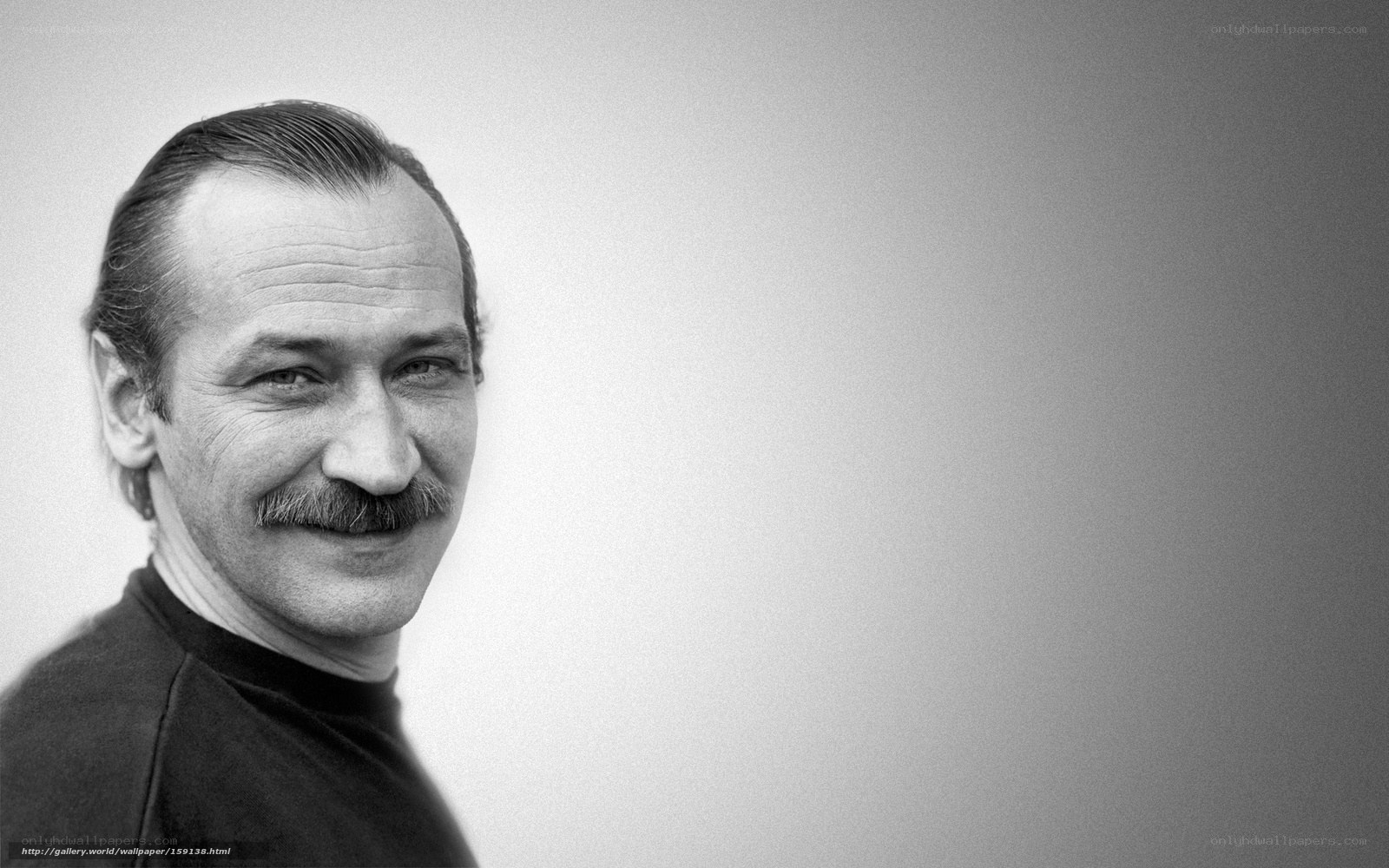 man with mustache smiling