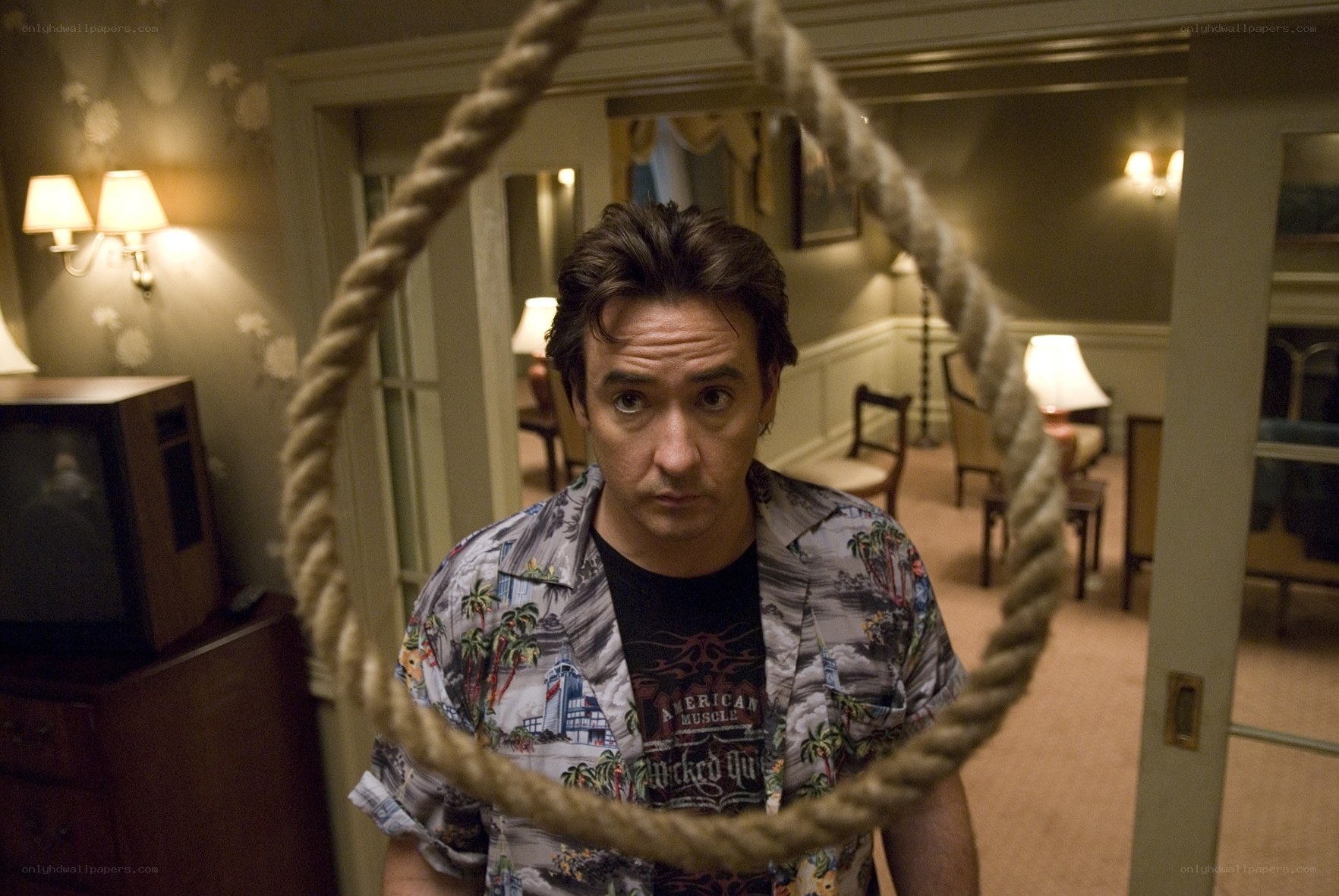 Man with noose in room