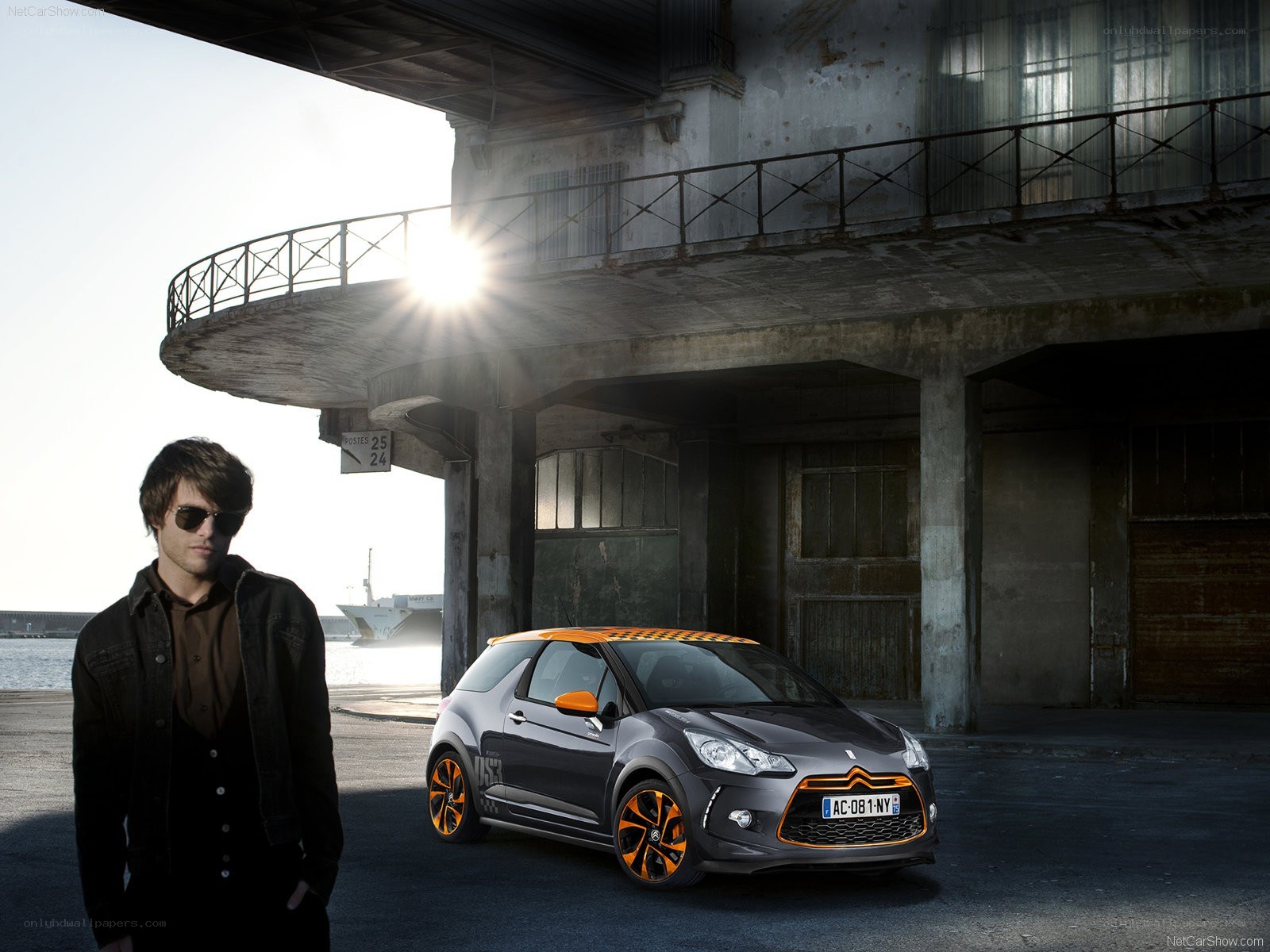 Man with orange-accented car