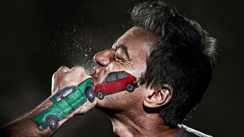Man with painted cars on face