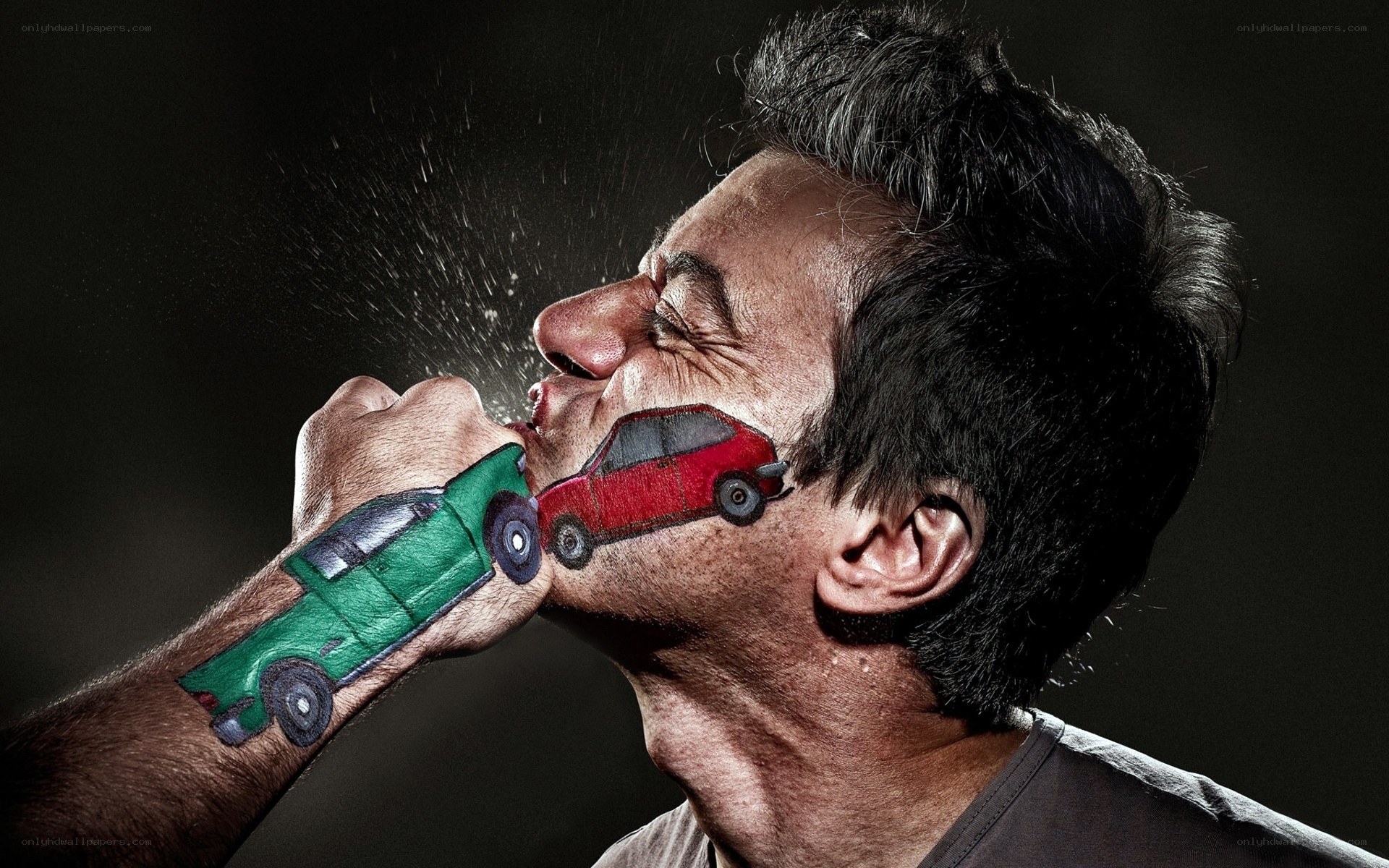 Man with painted cars on face