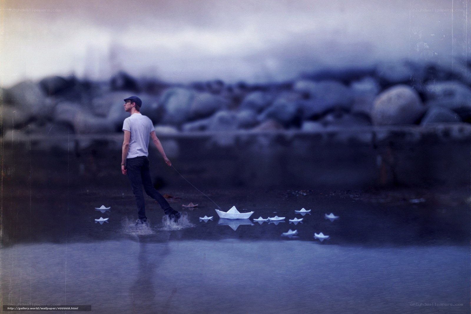 Man with paper boats