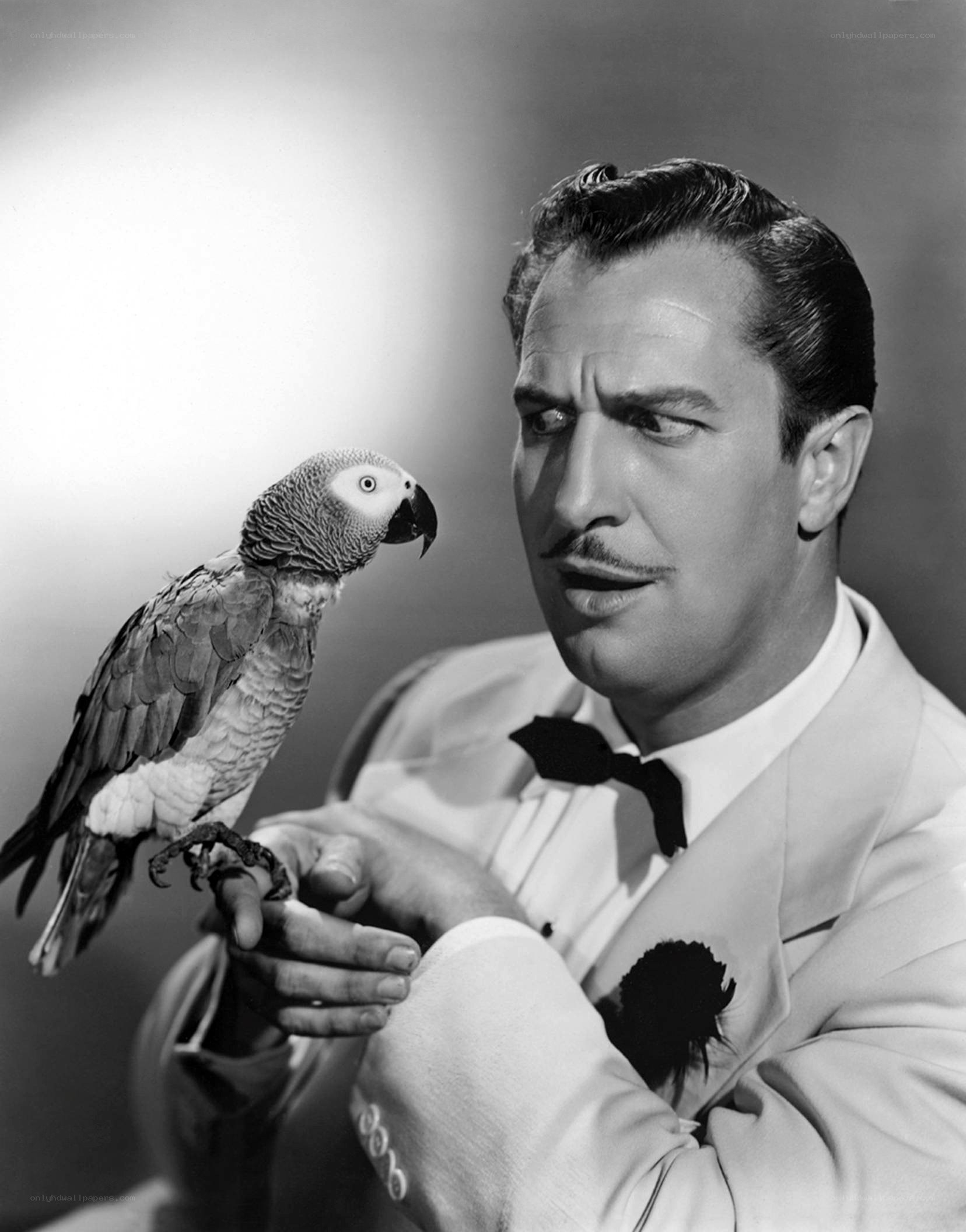 Man with parrot on hand