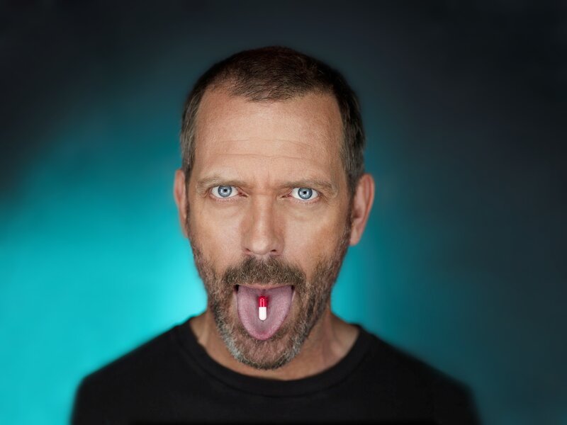 Man with Pill in Mouth