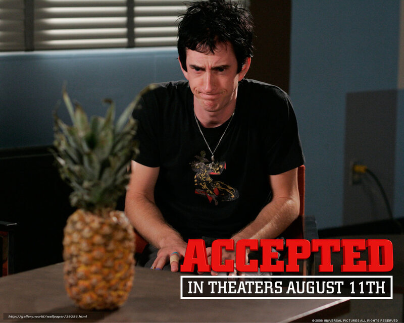 Man with pineapple on table