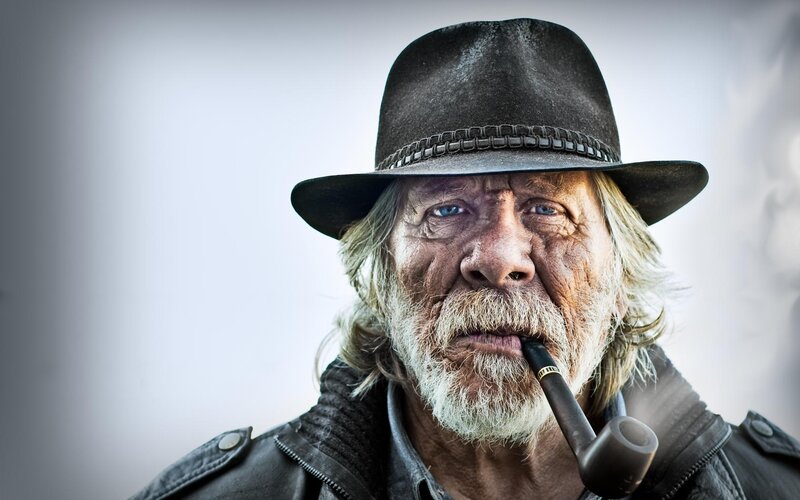 man with pipe and hat