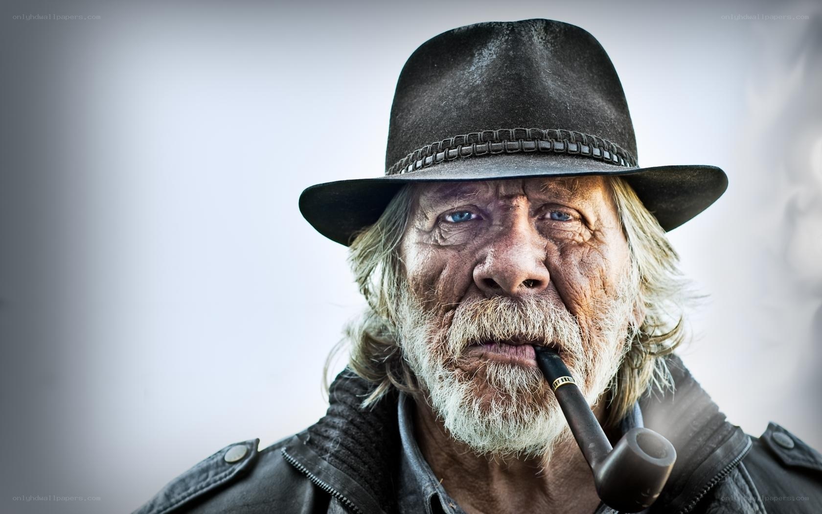 man with pipe and hat