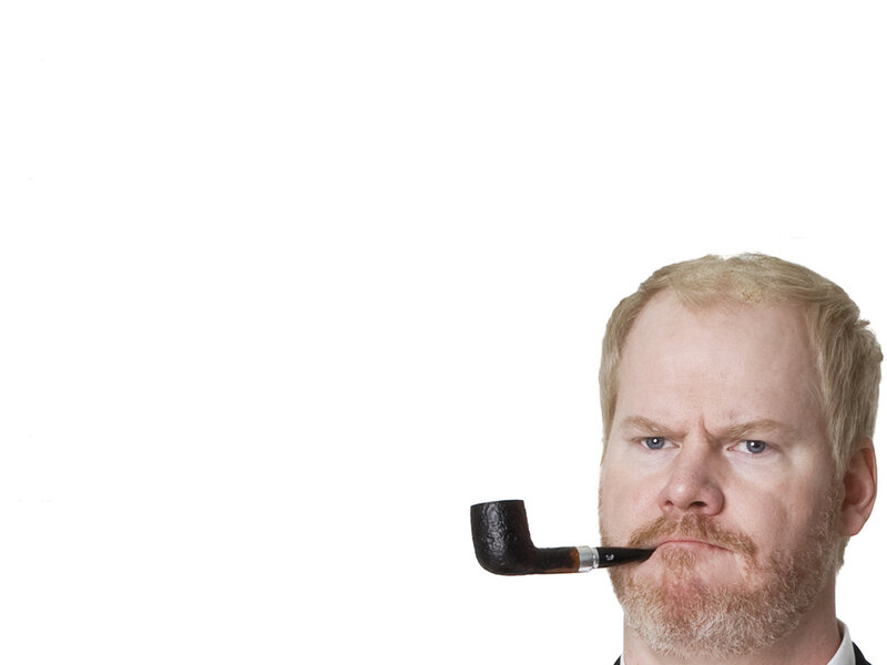 man with pipe and stern expression