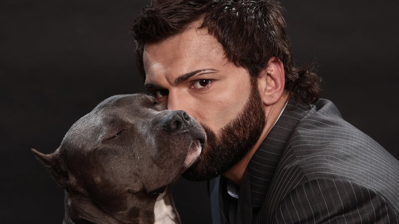 man with pitbull dog