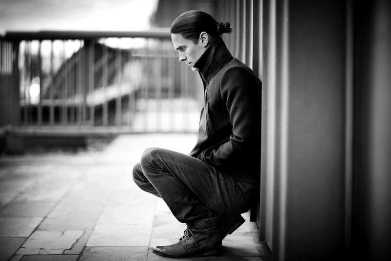 Man with Ponytail Sitting