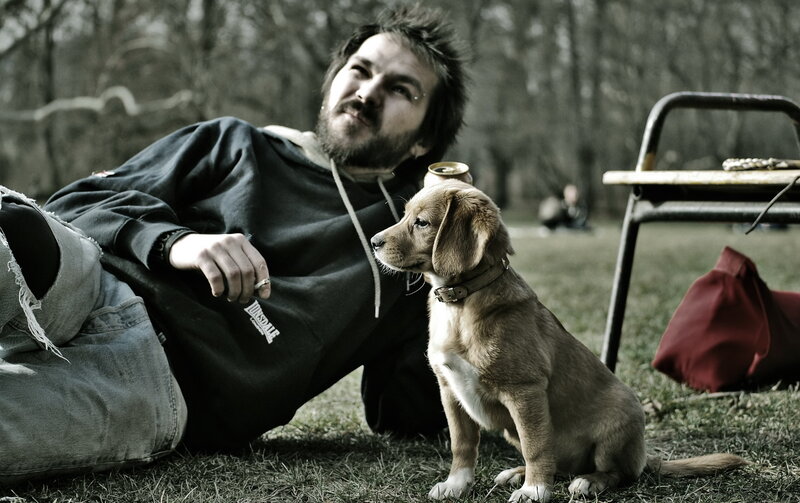 Man with puppy in park