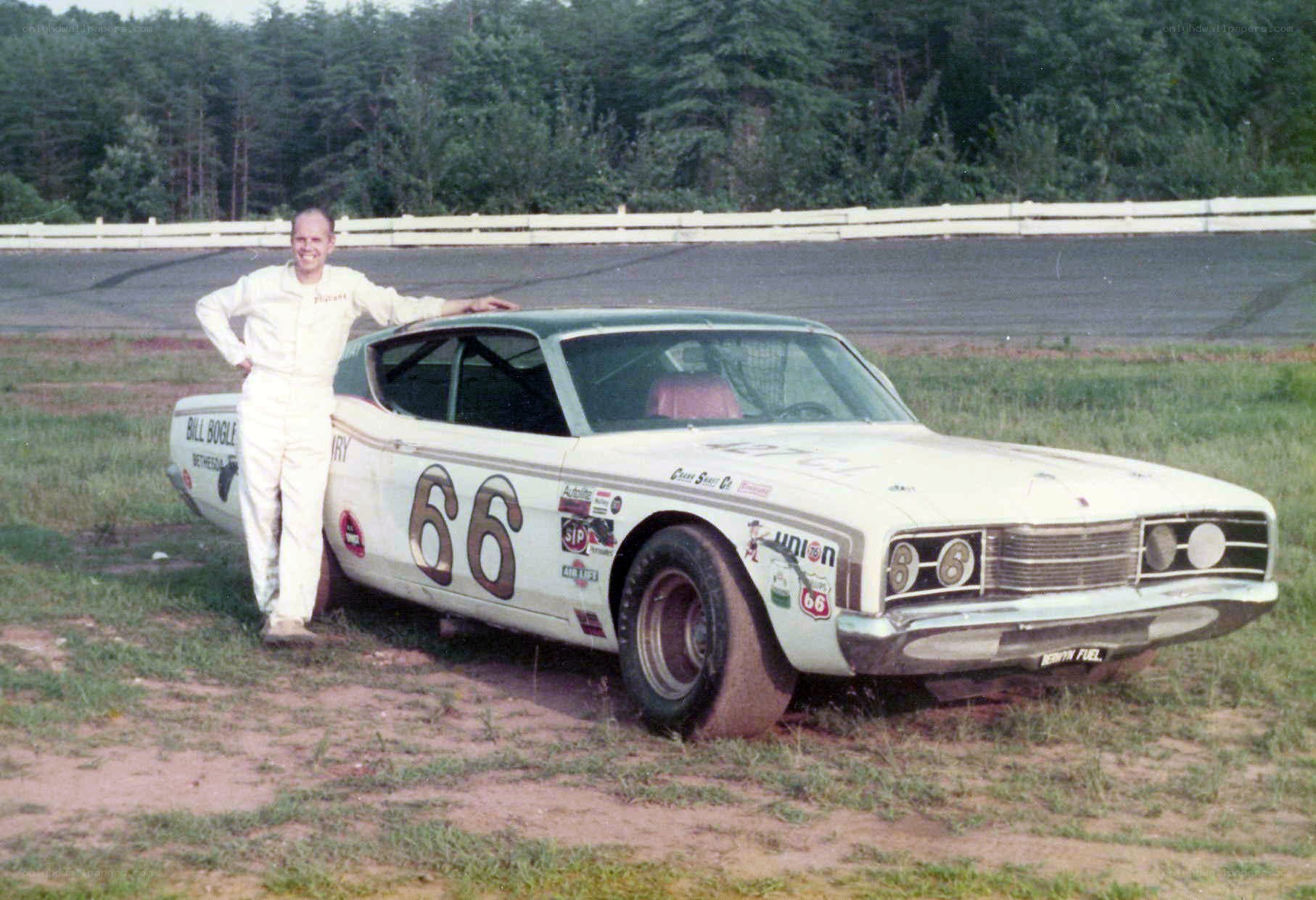 Man with race car at track