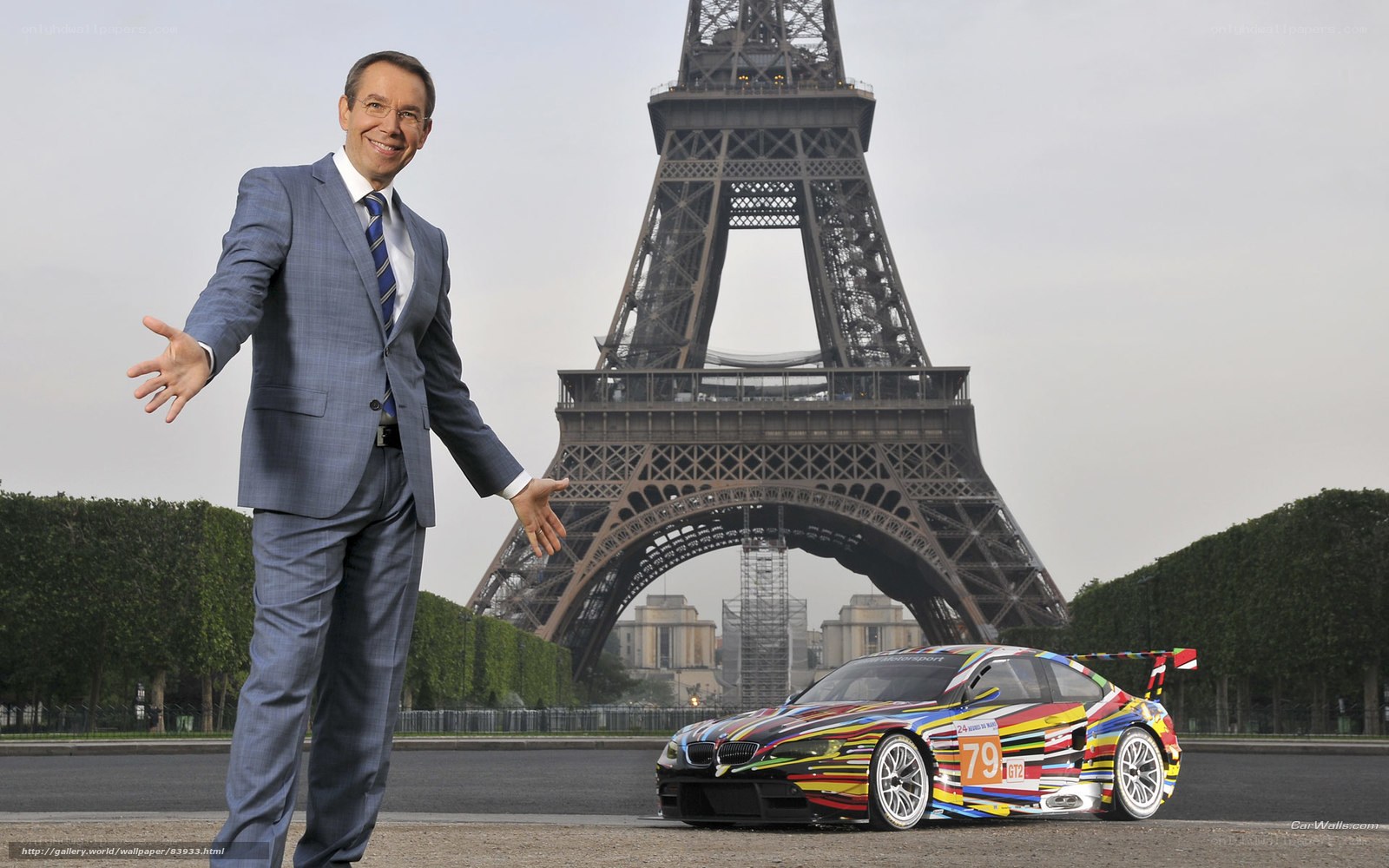 Man with race car near Eiffel Tower