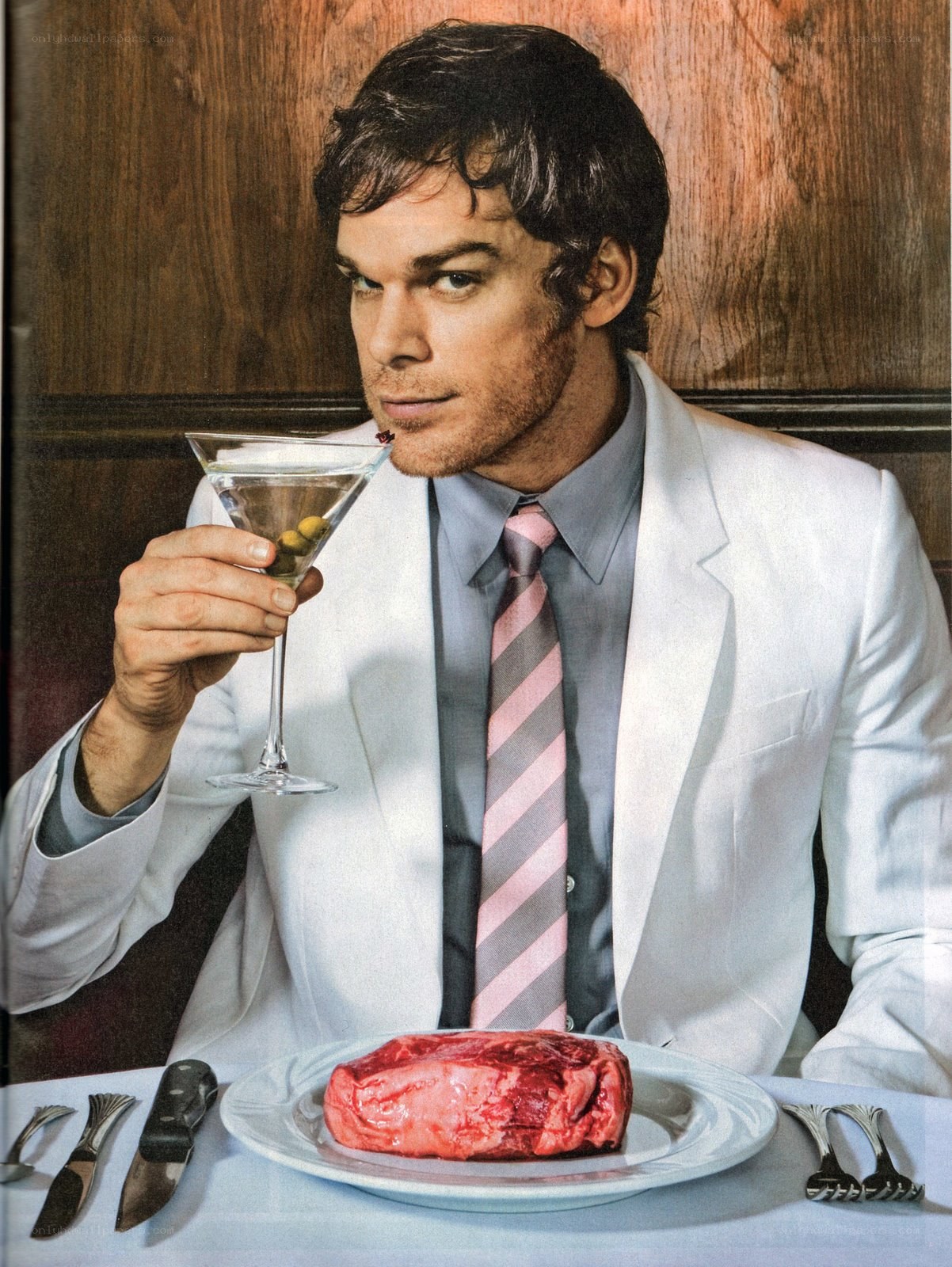 Man with raw meat and martini