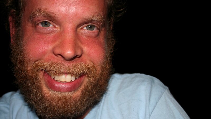 man with red beard smiling