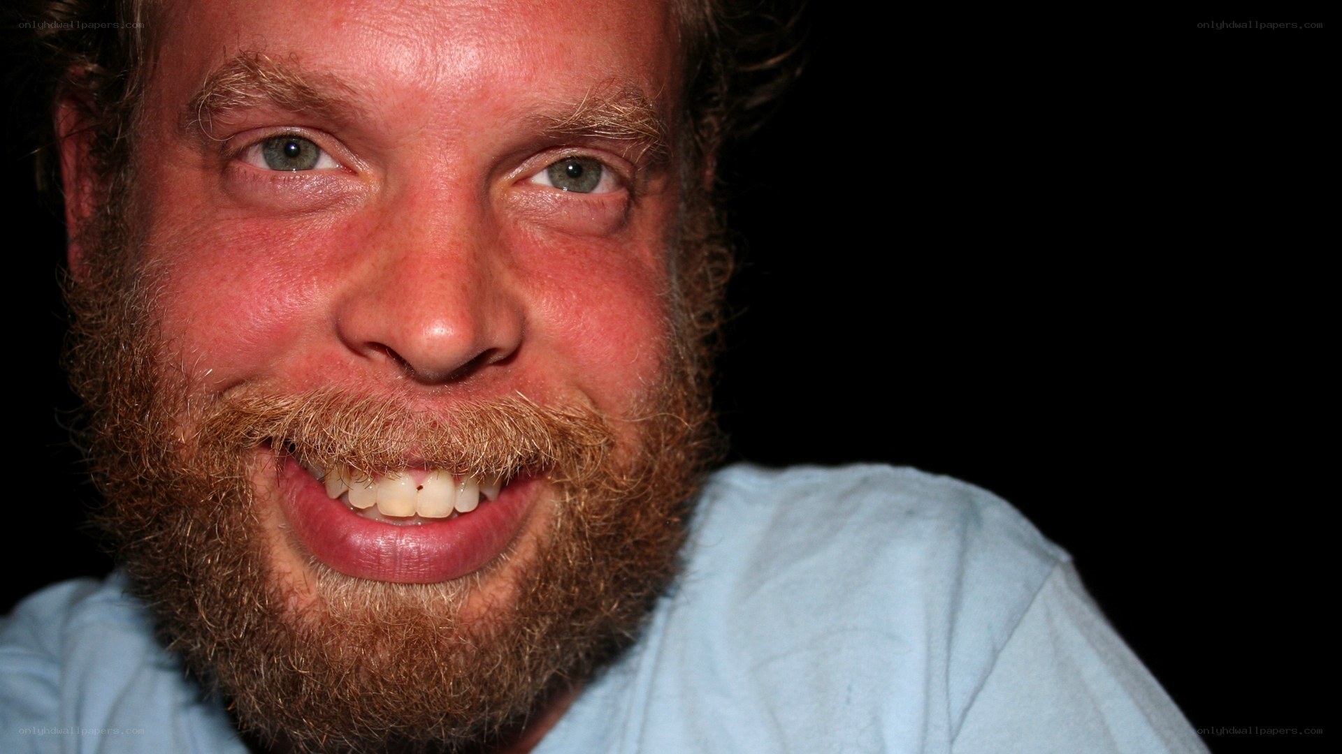 man with red beard smiling