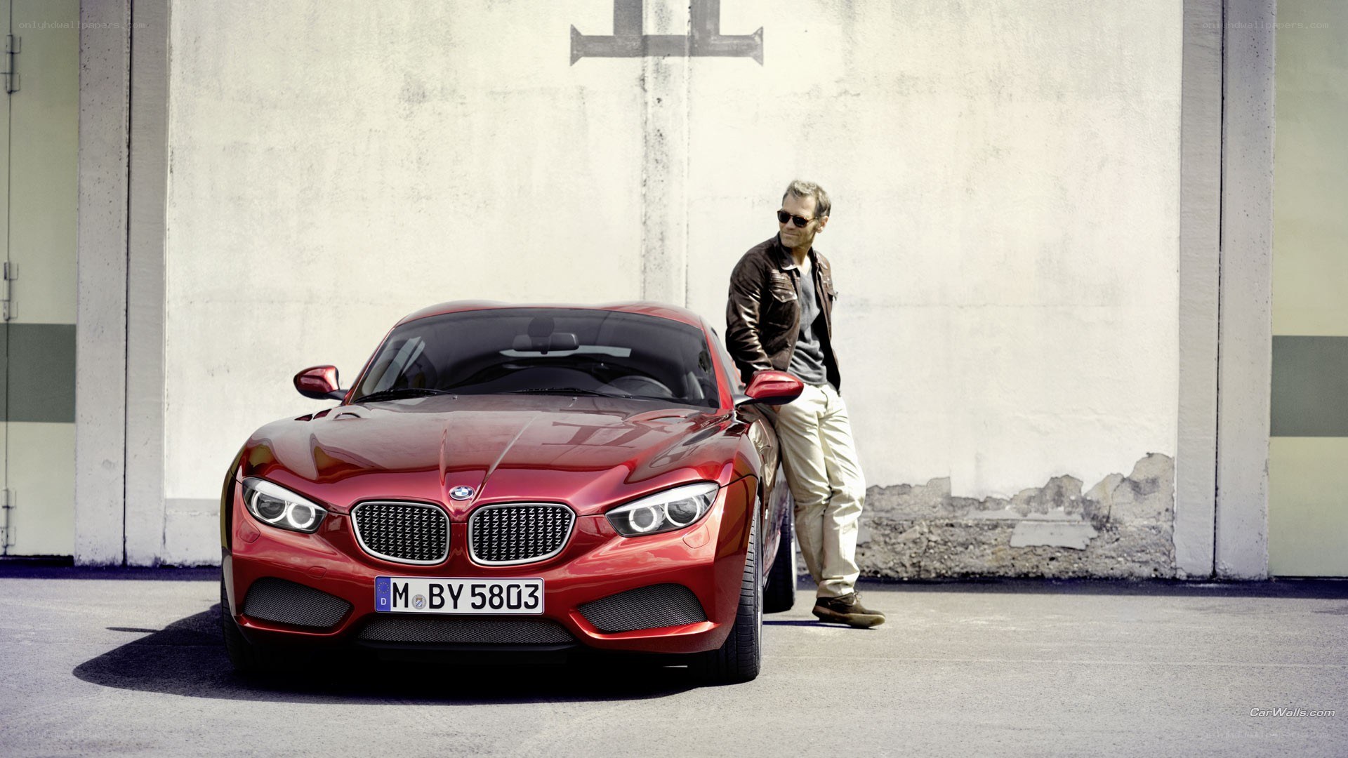 Man with red BMW car