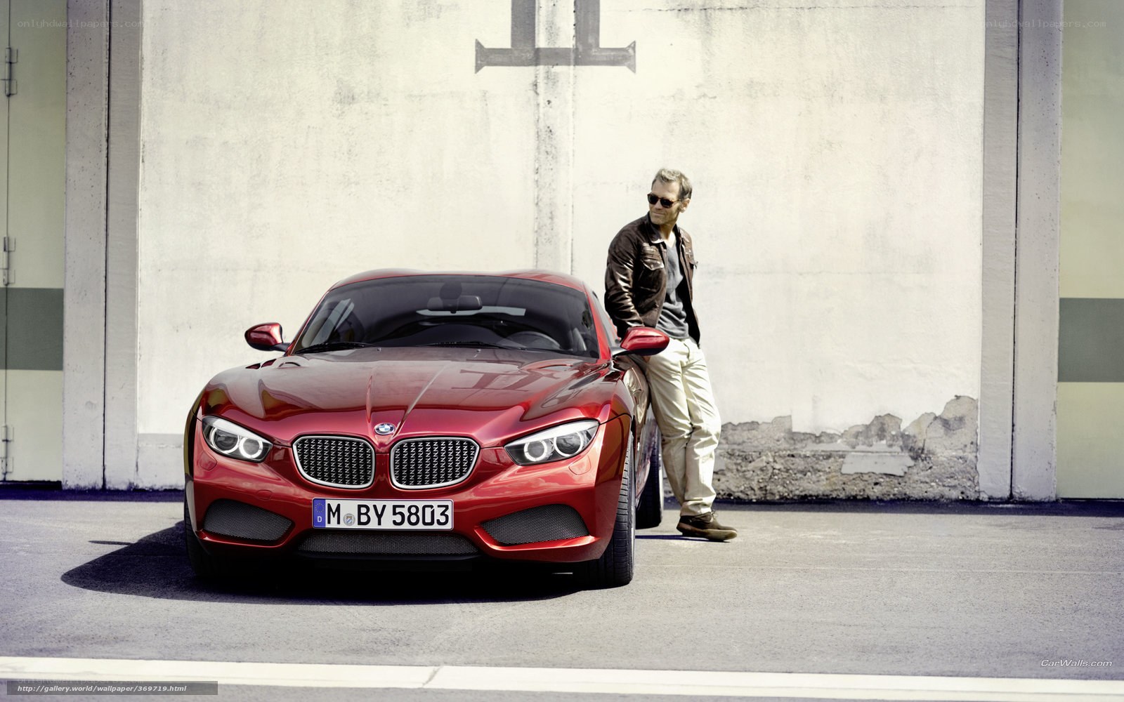 Man with red BMW car