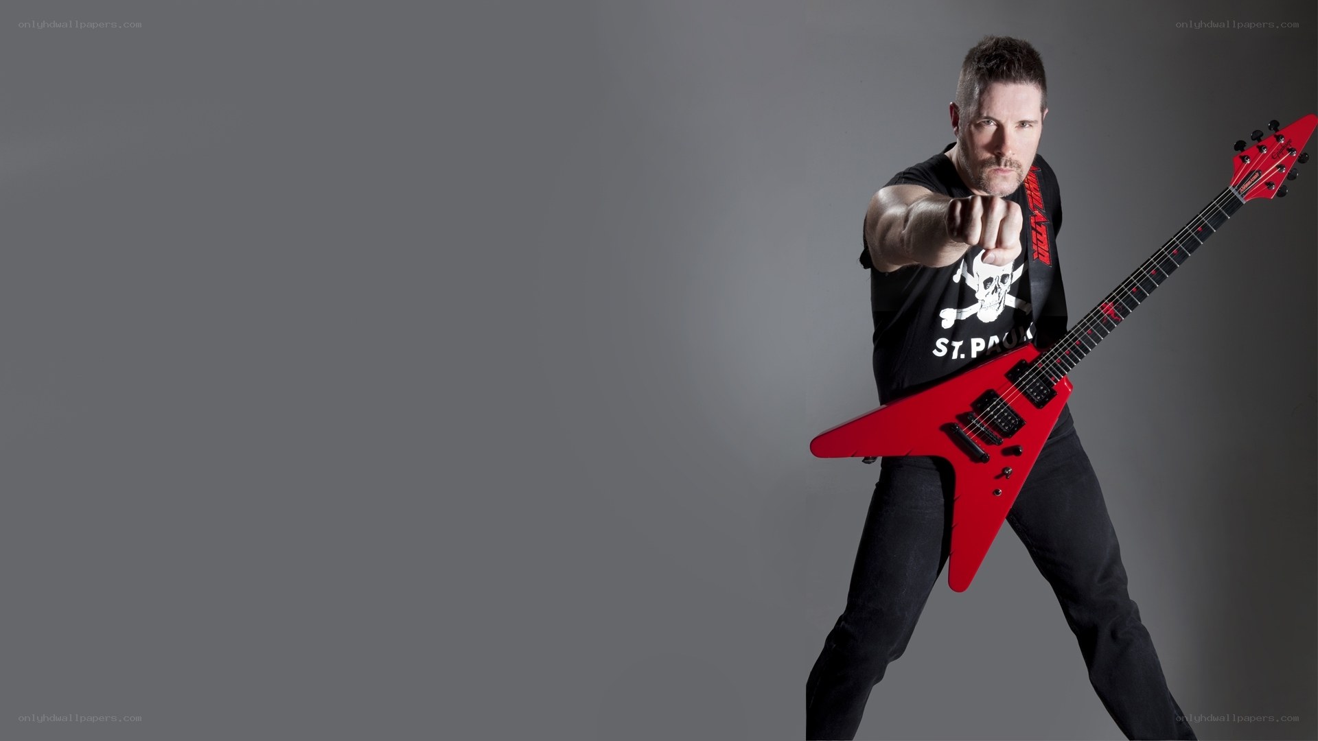 Man with red electric guitar
