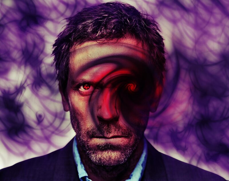 man with red eyes and purple background
