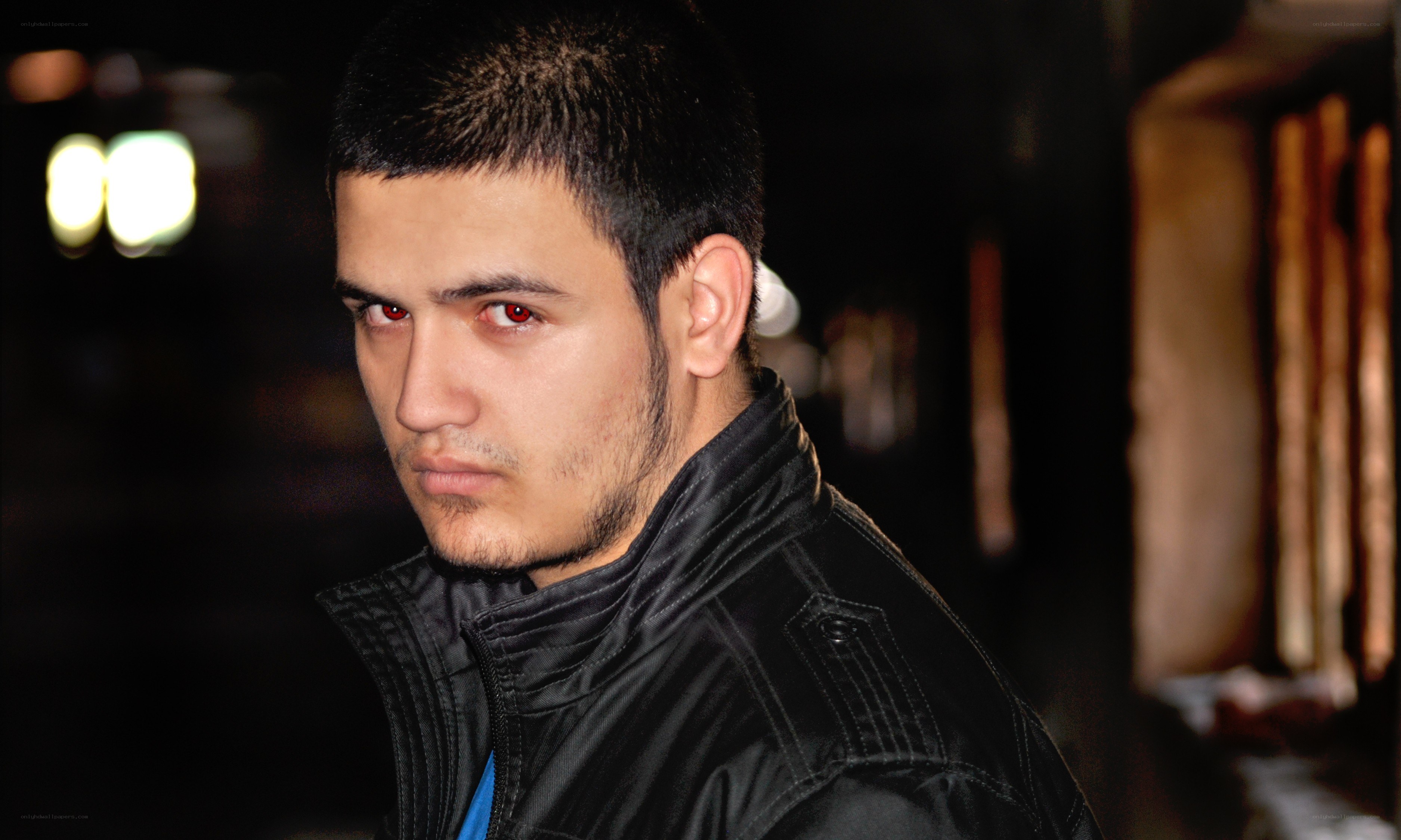 man with red eyes at night