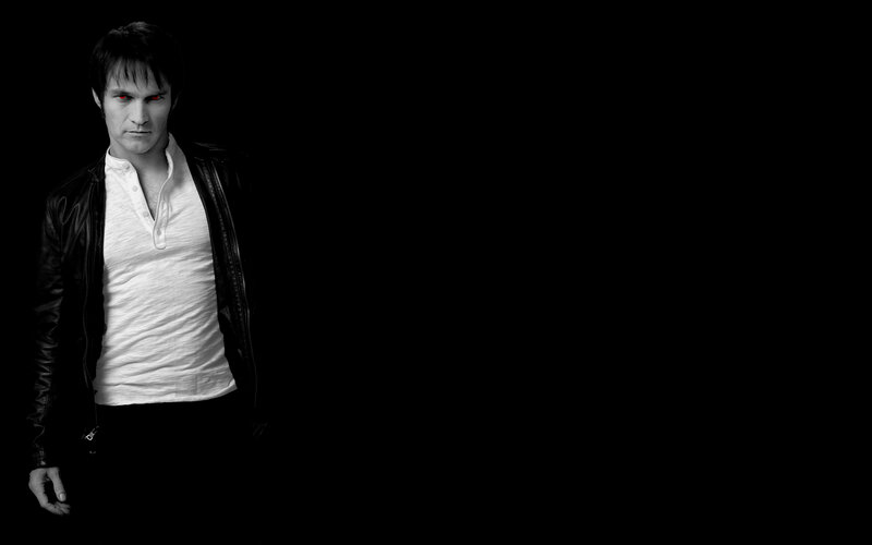man with red eyes in black and white