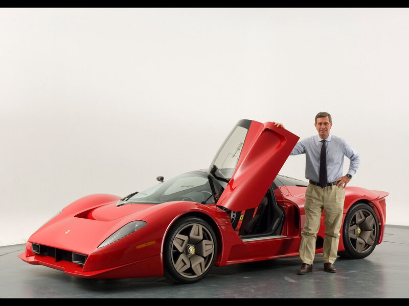 Man with red Ferrari