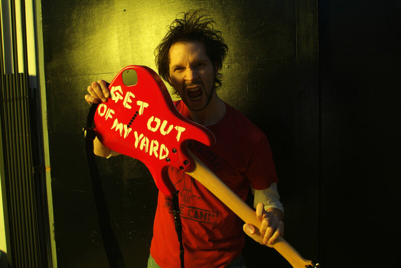 Man with red guitar
