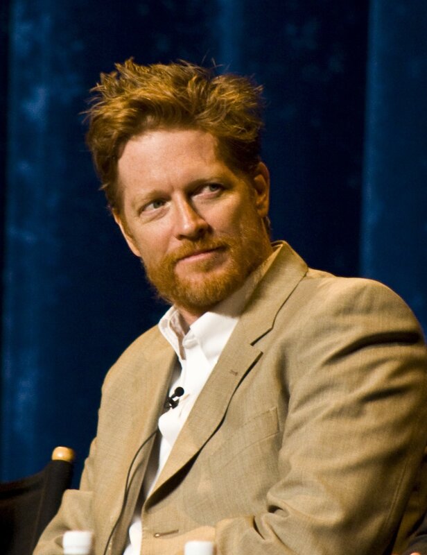 man with red hair in a suit