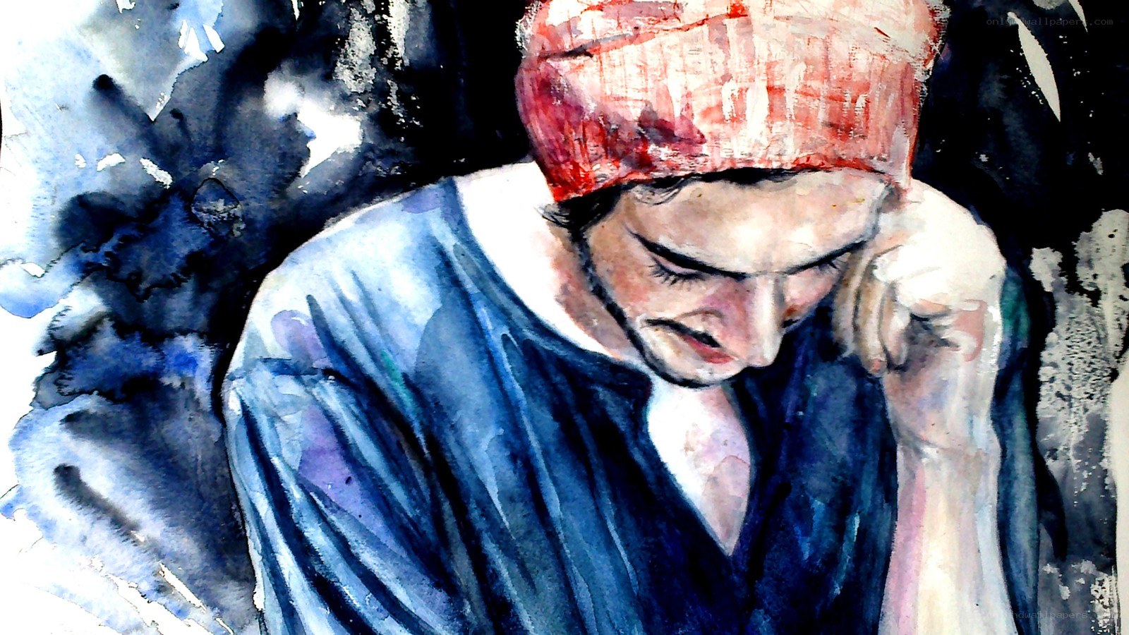 man with red head covering