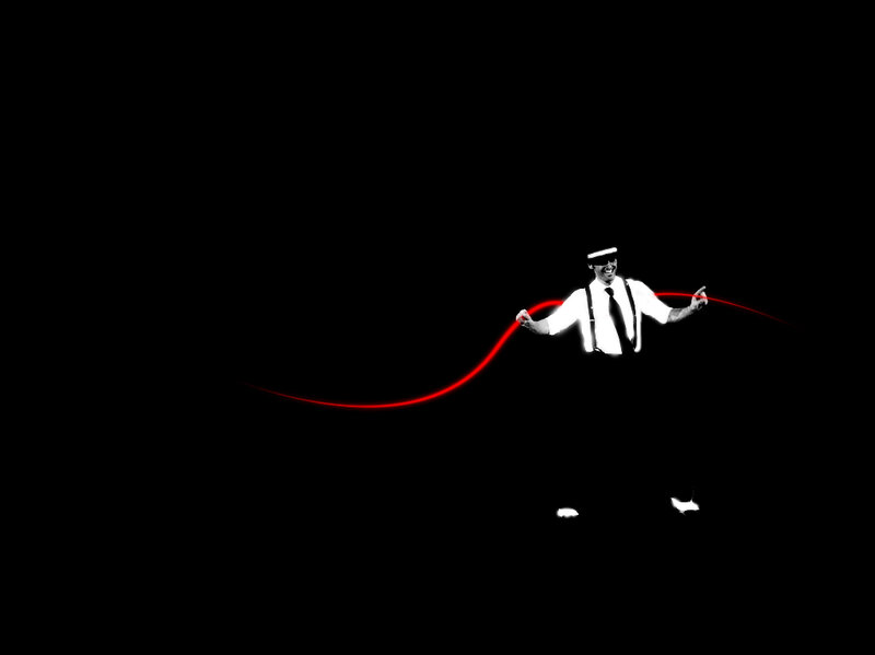 man with red light trail