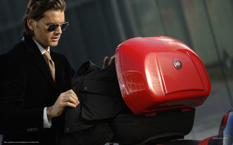 Man with red motorcycle storage