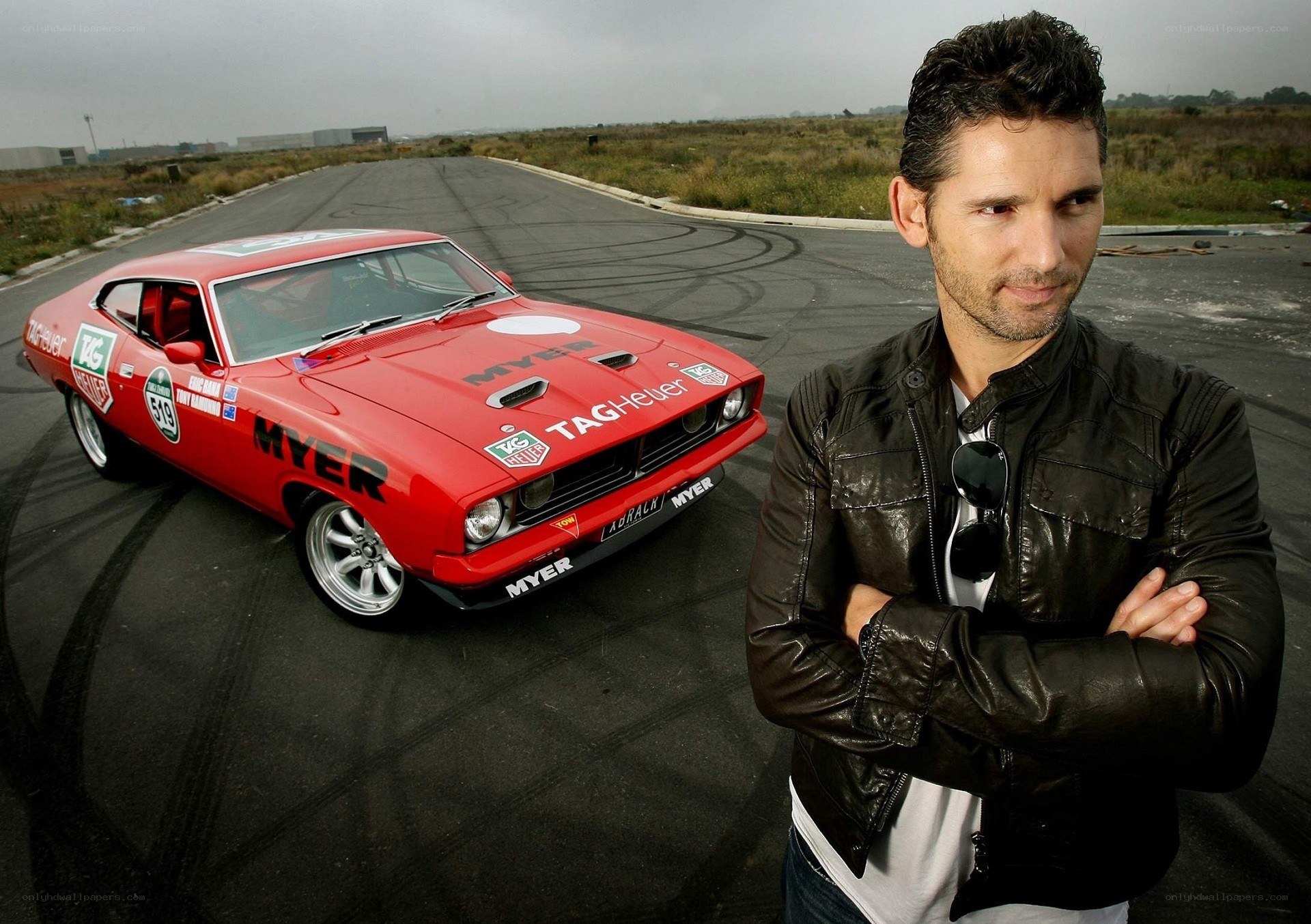 Man with red muscle car