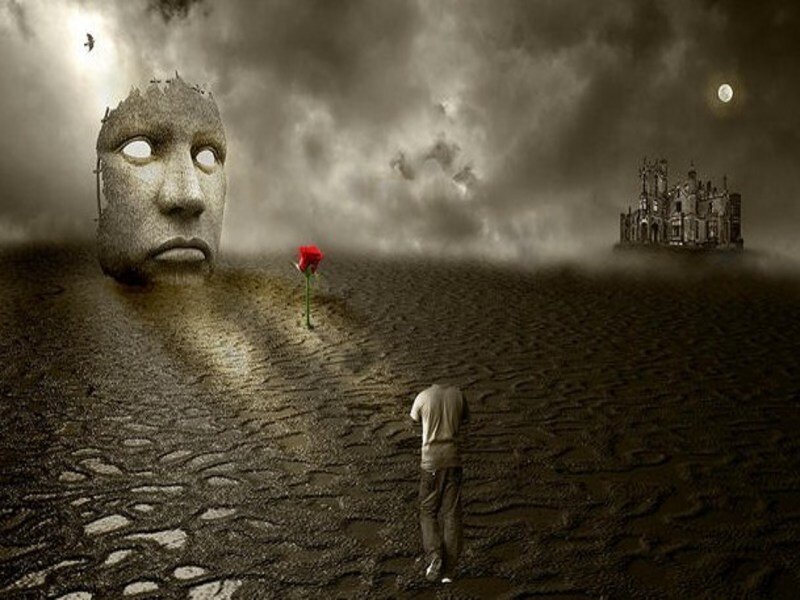 man with red rose in desolate landscape