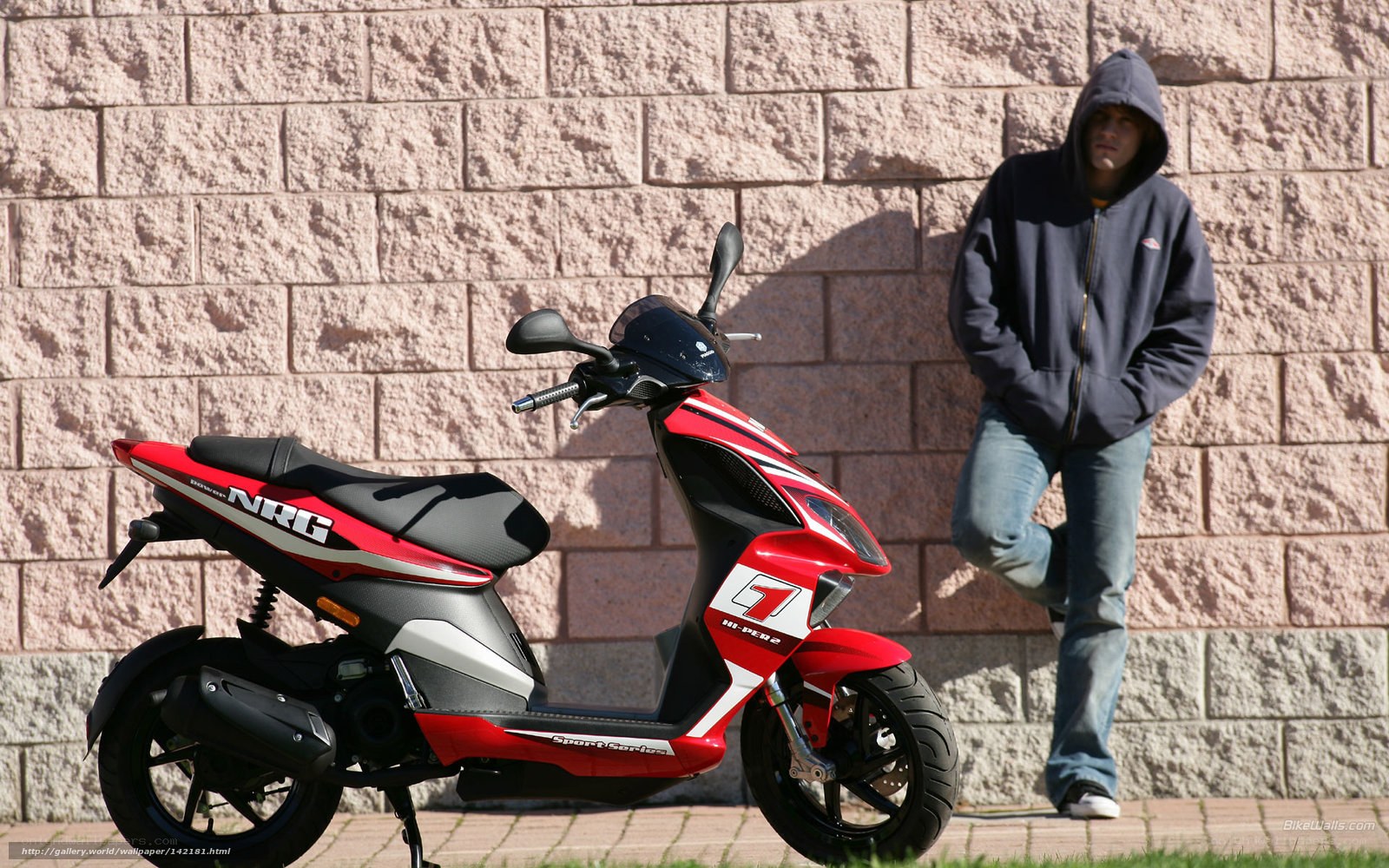 Man with red scooter