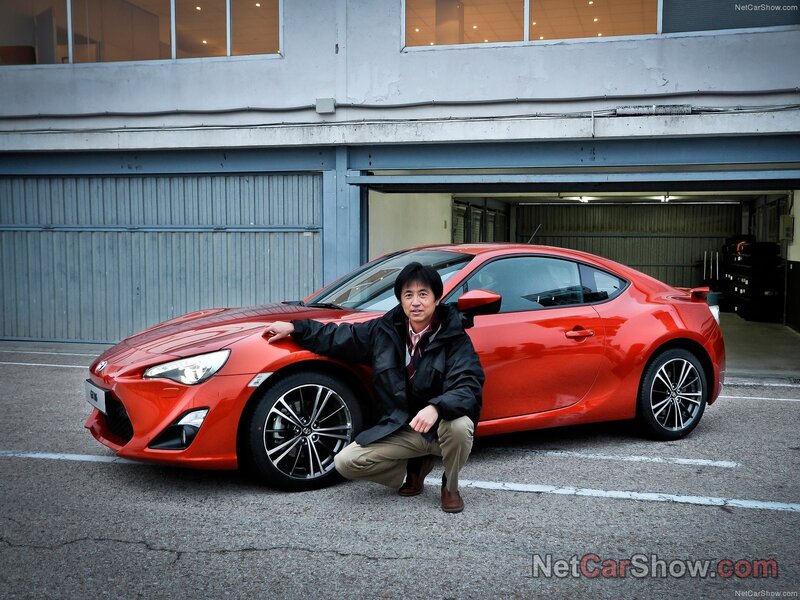 Man with red sports car